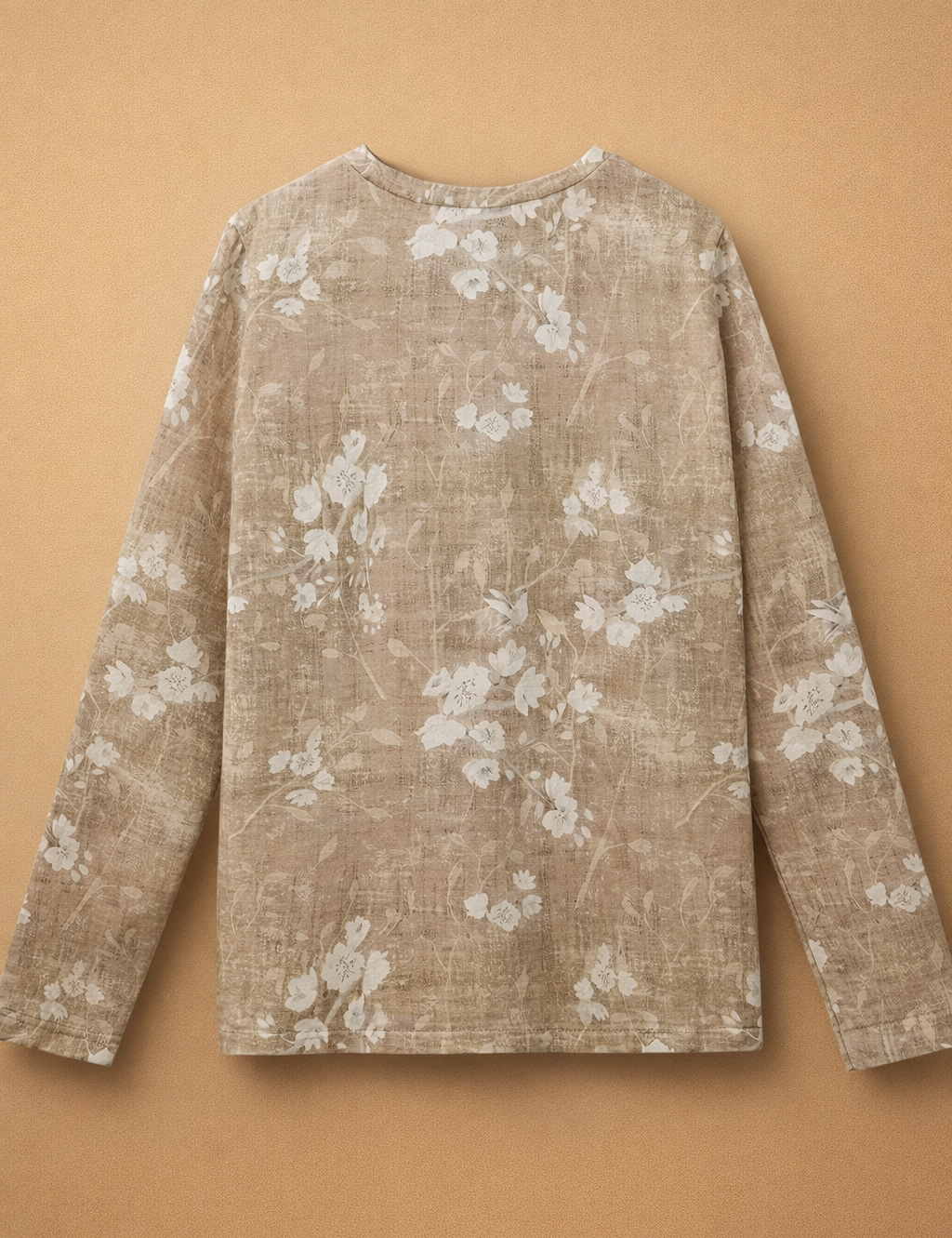 beige-floral-long-sleeve-top-european-studio-model-shot-caramel-sand-background.png