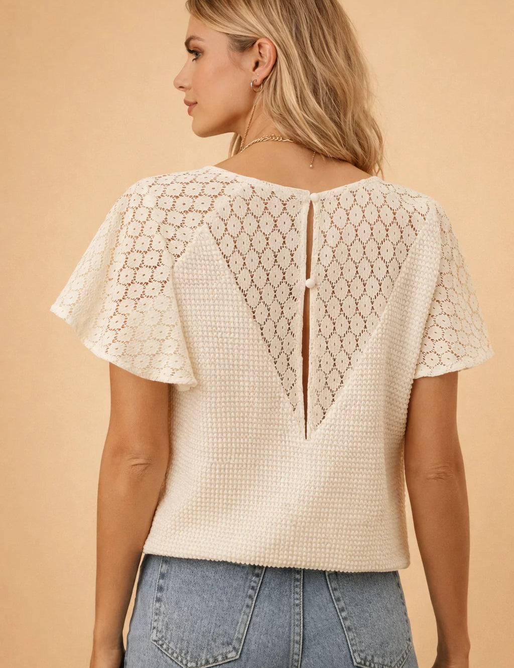 european-model-back-view-textured-lace-panel-blouse-flutter-sleeve-posed-studio-shot.webp