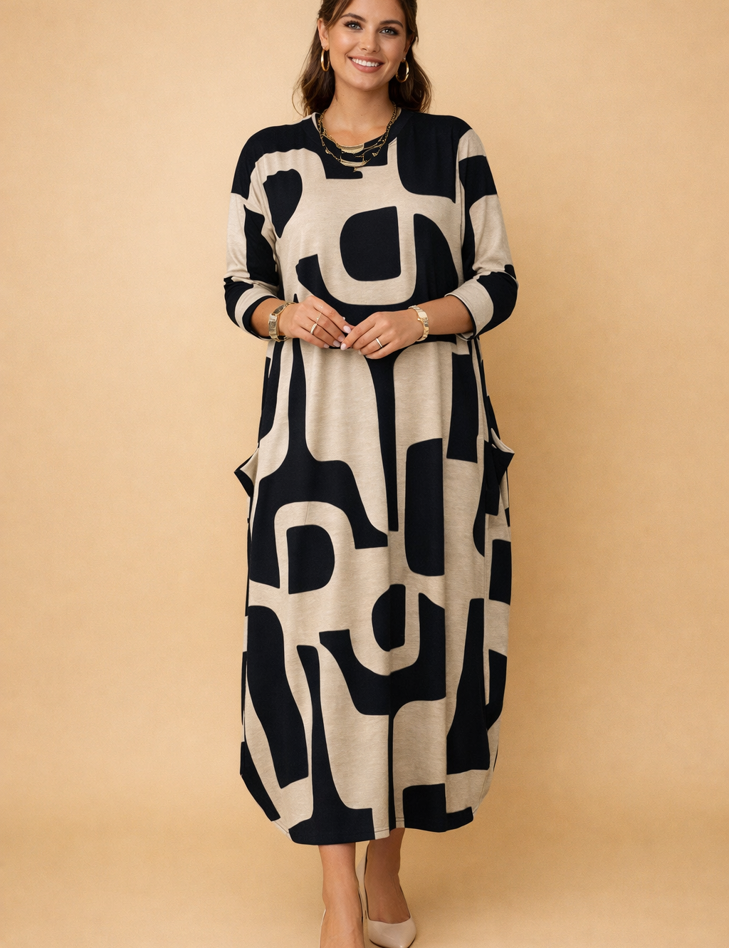 european-model-wearing-beige-black-geometric-maxi-dress-studio-posed-full-body.png