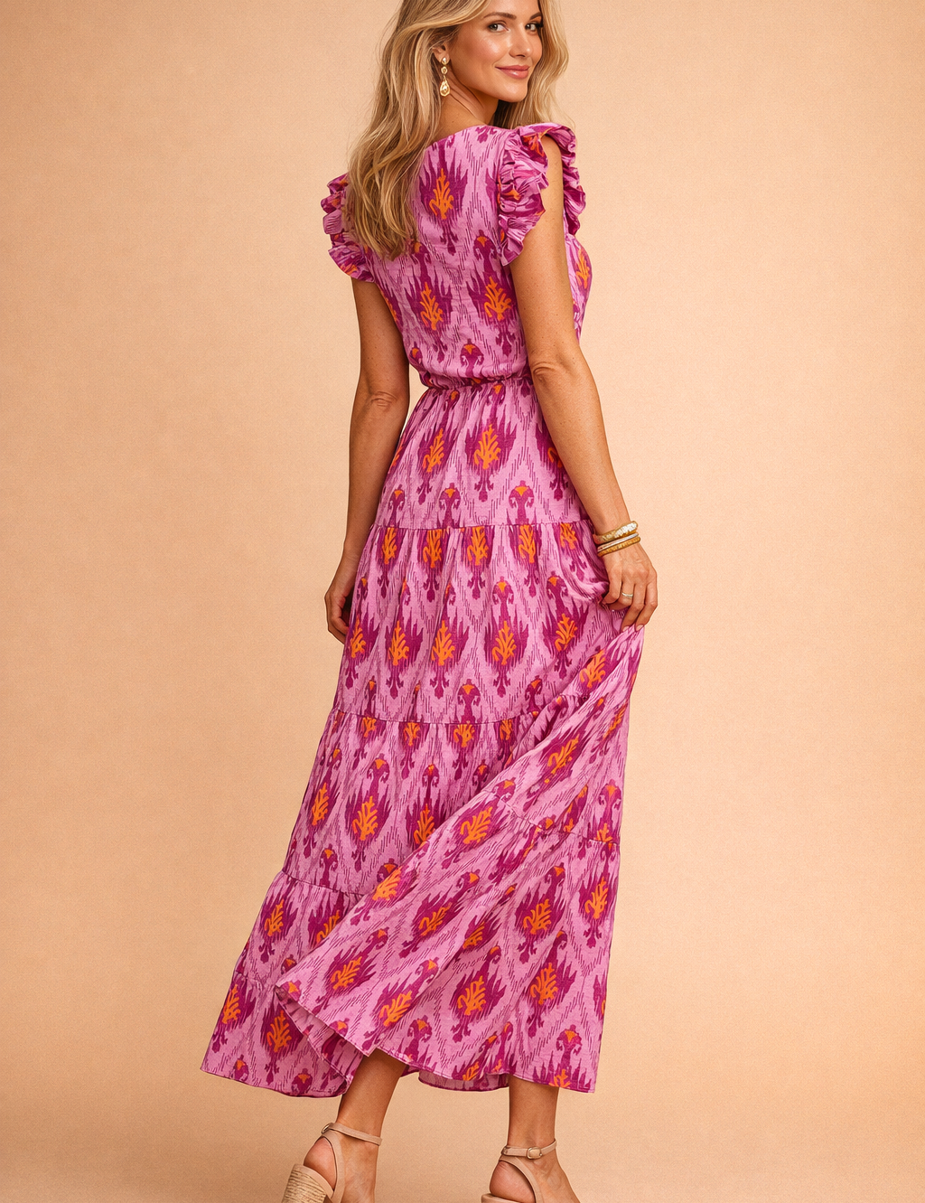polish-model-posed-studio-shot-pink-ikat-maxi-dress-caramel-backgroun.png