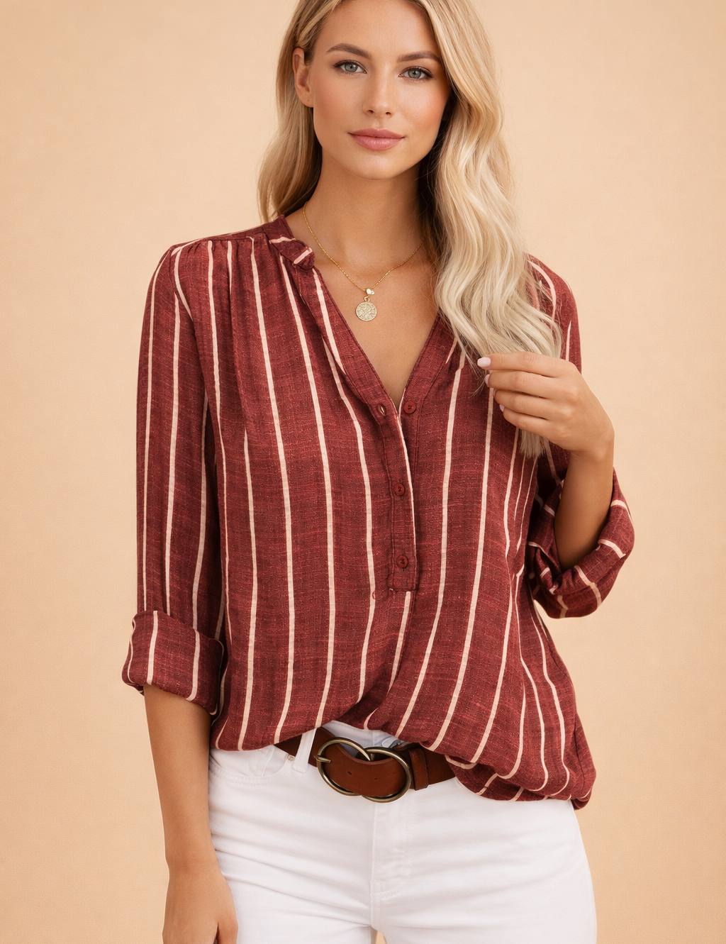 polish-model-posed-studio-shot-red-striped-womens-blouse-warm-sand-background-4x5.png